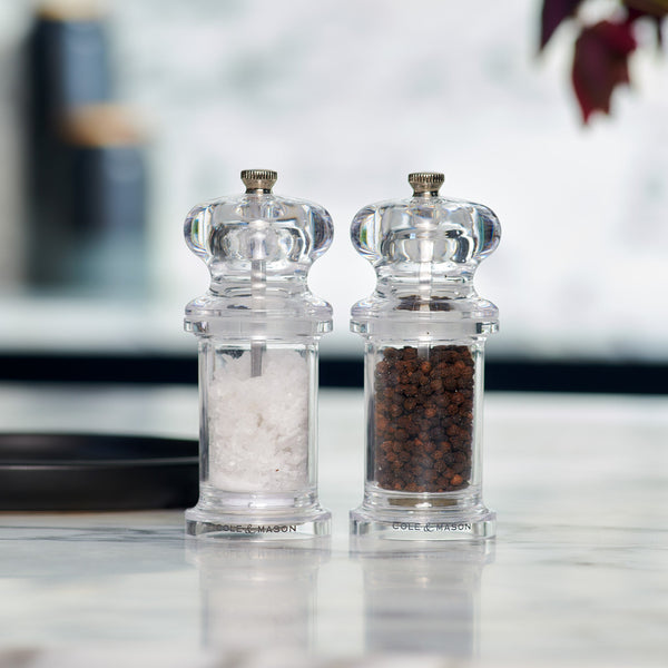 #salt&pepperset
The Cole & Mason 505 Salt & Pepper Mills sit side by side on a marble counter, each filled with salt or pepper. Their clear acrylic design and adjustable settings stand out against the softly blurred background for a modern touch.
