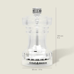 The Cole & Mason Acrylic Salt Shaker & Pepper Mill Set features a clear body with signature branding. Each adjustable grinder stands 104 mm (4 in) tall and 50 mm (1.9 in) wide, displayed against a light beige background.